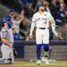 Toronto Blue Jays' Bo Bichette watches his three-run home run against the Los Angeles Dodgers as the Dodgers catcher kneels during Game 7 of baseball's World Series.