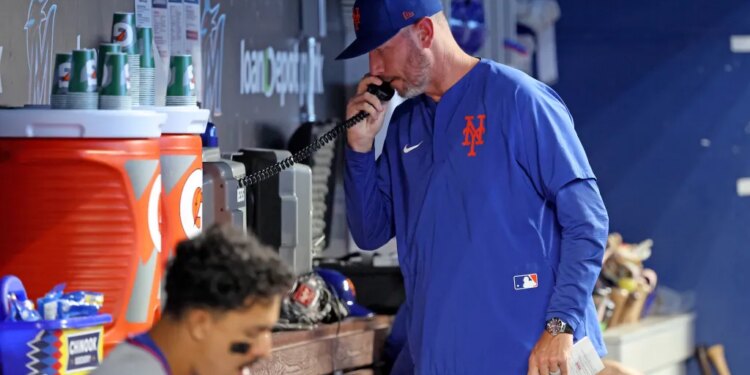 New York Mets pitching coach Jeremy Hefner on the bullpen phone during the 8th inning.