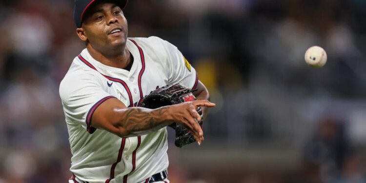 Atlanta Braves pitcher Raisel Iglesias throws to first base in the eighth inning of a baseball game against the Milwaukee Brewers, Aug. 6, 2025, in AtlantaAtlanta Braves pitcher Raisel Iglesias throws to first base in the eighth inning of a baseball game against the Milwaukee Brewers, Aug. 6, 2025, in Atlanta