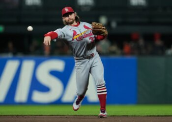 St. Louis Cardinals second baseman Brendan Donovan throws to first base during a baseball game.