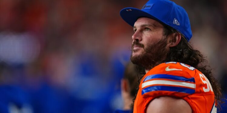 Broncos inside linebacker Alex Singleton watches from the sidelines during the second half of an NFL football game against the Las Vegas Raiders Thursday, Nov. 6, 2025, in Denver.