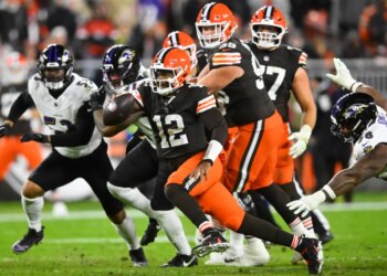 Browns quarterback Shedeur Sanders (12) runs the ball against the Ravens on Nov. 16, 2025.