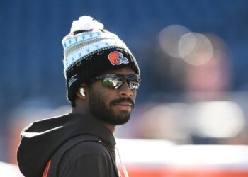 Browns quarterback Shedeur Sanders (12) looks on during warm up prior to the game against the New England Patriots at Gillette Stadium.