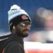Browns quarterback Shedeur Sanders (12) looks on during warm up prior to the game against the New England Patriots at Gillette Stadium.