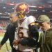 Washington Commanders quarterback Jayden Daniels (5) is helped off the field after an injury during the second half against the Seattle Seahawks.