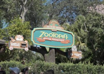 Zootopia: Better Zoogether! sign at the Tree of Life Theater with Stand-By Entrance and Lightning Lane signs.