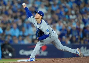 Los Angeles Dodgers pitcher Yoshinobu Yamamoto (18) pitches against the Toronto Blue Jays in the sixth inning during game six of the 2025 MLB World Series at Rogers Centre.