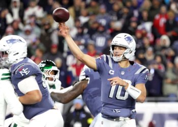 Drake Maye #10 of the New England Patriots throws a pass during the second quarter.
