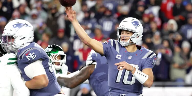 Drake Maye #10 of the New England Patriots throws a pass during the second quarter.