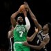 Boston Celtics guard Jaylen Brown (7) attempts to pass away from Brooklyn Nets guard Drake Powell (4) during the second half of an NBA basketball game, Tuesday, Nov. 18, 2025, in New York.