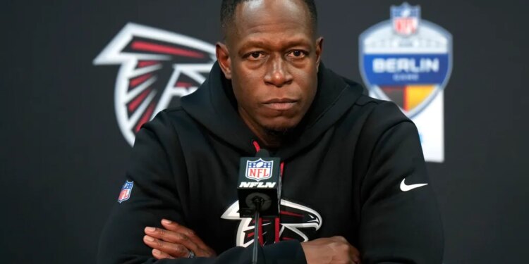 Atlanta Falcons head coach Raheem Morris speaks at a news conference.