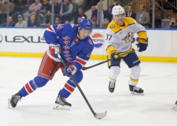 New York Rangers right wing Gabe Perreault (94) moves the puck down ice during the first period against the Nashville Predators.