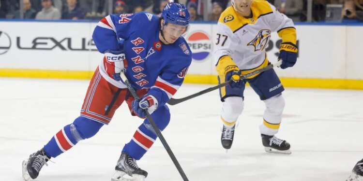 New York Rangers right wing Gabe Perreault (94) moves the puck down ice during the first period against the Nashville Predators.
