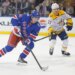 New York Rangers right wing Gabe Perreault (94) moves the puck down ice during the first period against the Nashville Predators.