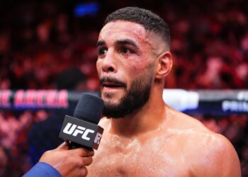 UFC fighter faces a microphone during the Thompson v Bonfim fight.