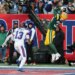 Green Bay Packers safety Evan Williams (33) intercepts a pass intended for New York Giants wide receiver Jalin Hyatt (13) in the end zone.