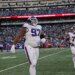 New York Giants defensive tackle Dexter Lawrence II (97) and guard Jon Runyan (76) walk off the field after the Giants gave up a 2-point conversion.