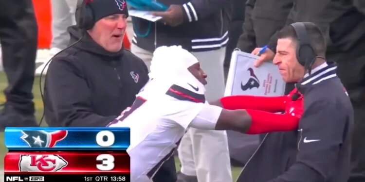 Kris Boyd shoves Texans special teams coach Frank Ross during a playoff game against the Chiefs on Jan. 18, 2025.