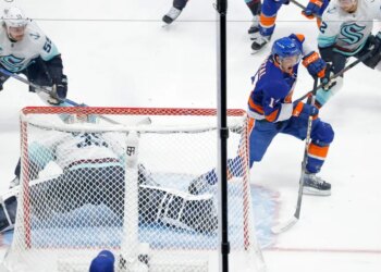 Mathew Barzal of the New York Islanders taking a shot on goal.