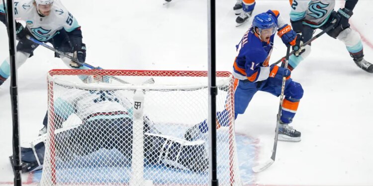 Mathew Barzal of the New York Islanders taking a shot on goal.