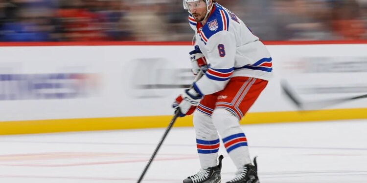 Rangers center J.T. Miller (8) controls the puck in the first period against the Colorado Avalanche at Ball Arena.