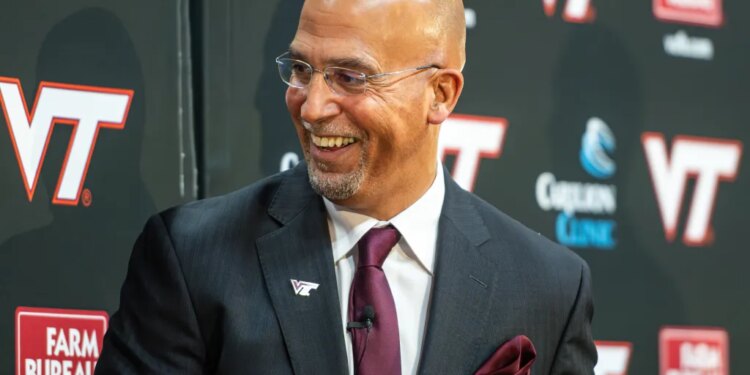 James Franklin, Virginia Tech's new head football coach, smiles during a news conference.