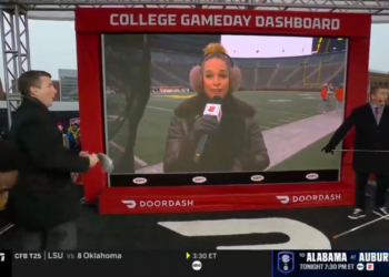 Jess Sims lets a NSFW comment slip on College GameDay while reporting in Michigan.