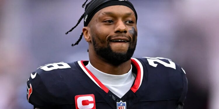 Houston Texans running back Joe Mixon jogging onto the field.