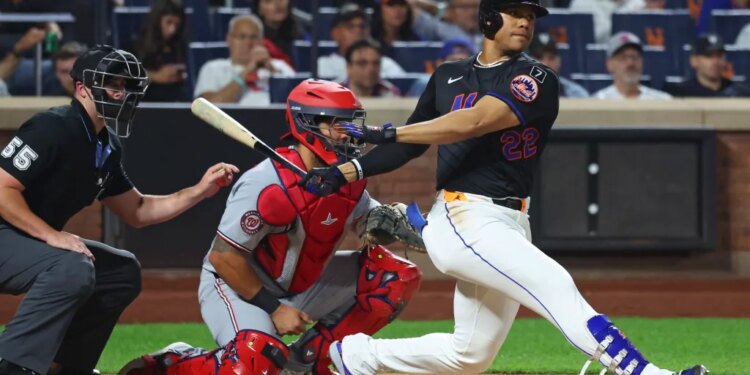 Juan Soto of the New York Mets hits a single during a game against the Washington Nationals.