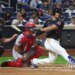 Juan Soto of the New York Mets hits a single during a game against the Washington Nationals.