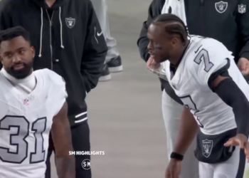 Two Las Vegas Raiders players on the field.