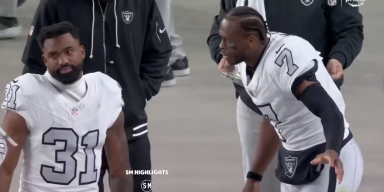Two Las Vegas Raiders players on the field.