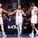 Jalen Brunson of the New York Knicks is greeted by Landry Shamet and Mikal Bridges after scoring.