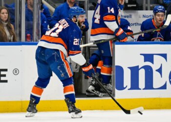 New York Islanders center Kyle Palmieri (21) makes a pass after being injured against the Philadelphia Flyers during the second period.