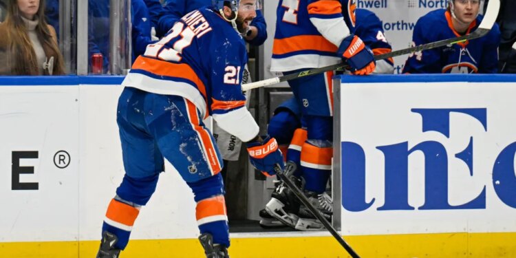 New York Islanders center Kyle Palmieri (21) makes a pass after being injured against the Philadelphia Flyers during the second period.