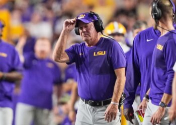 LSU head coach Brian Kelly watches the game from the sideline.