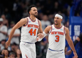 guard Landry Shamet (44) is congratulated by teammate Josh Hart (3) after Shemet scored a three pointer in the second half of an NBA basketball game against the Dallas Mavericks Wednesday, Nov. 19, 2025, in Dallas.