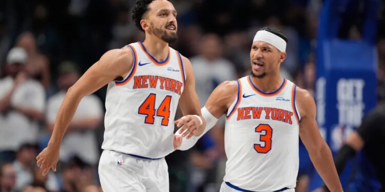 guard Landry Shamet (44) is congratulated by teammate Josh Hart (3) after Shemet scored a three pointer in the second half of an NBA basketball game against the Dallas Mavericks Wednesday, Nov. 19, 2025, in Dallas.