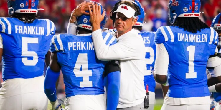 Mississippi Rebels head coach Lane Kiffin embraces linebacker Suntarine Perkins (4) during the second half against the Florida Gators.