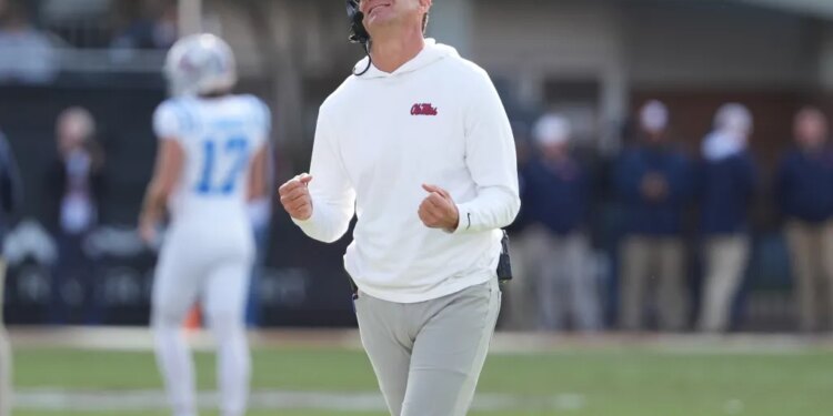 Lane Kiffin reacting to a call during an NCAA college football game.