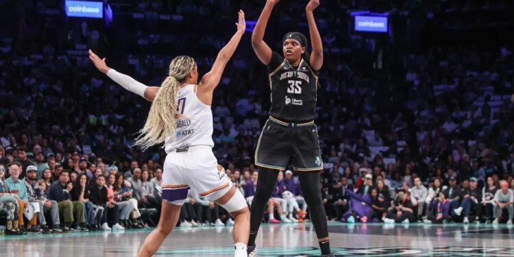 New York Liberty center Jonquel Jones (35) shoots past Phoenix Mercury forward Satou Sabally (0) during the 2025 WNBA Playoffs.
