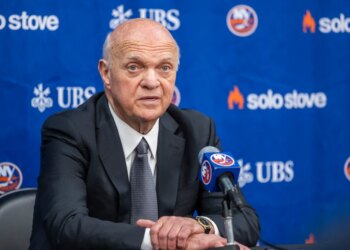 New York Islanders GM Lou Lamoriello speaking at a press conference.
