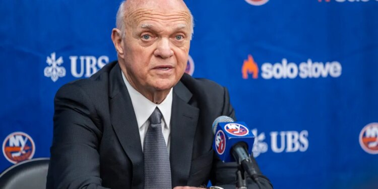 New York Islanders GM Lou Lamoriello speaking at a press conference.