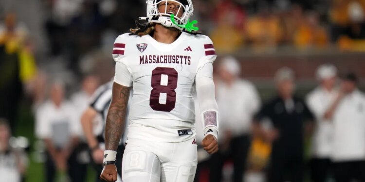 Massachusetts quarterback AJ Hairston reacts after throwing an incomplete pass.