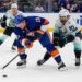 New York Islanders' Mathew Barzal (13) drives past Seattle Kraken's Matty Beniers