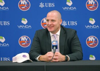 New York Islanders GM Mathieu Darche speaking at a press conference.