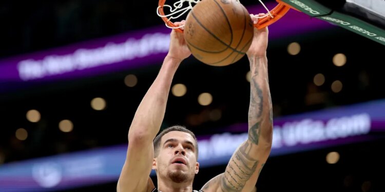 Michael Porter Jr. slams home a dunk during the Nets' upset win over the Celtics on Nov. 21, 2025.