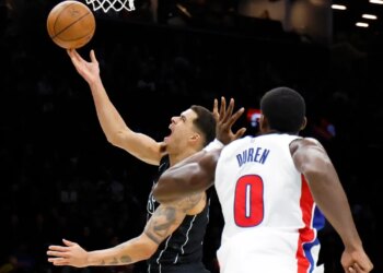 Brooklyn Nets forward Michael Porter Jr. puts up a shot past a defending Detroit Pistons center Jalen Duren (R) in the first half at the Barclays Center in Brooklyn, New York, November 07, 2025.