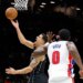 Brooklyn Nets forward Michael Porter Jr. puts up a shot past a defending Detroit Pistons center Jalen Duren (R) in the first half at the Barclays Center in Brooklyn, New York, November 07, 2025.