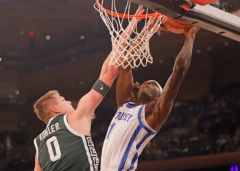 Michigan State Spartans forward Jaxon Kohler (0) stops Kentucky Wildcats guard Denzel Aberdeen (1) at the basket during the first half when the Kentucky Wildcats played the Michigan State Spartans as part of the State Farm Champions Classic Tuesday, November 18, 2025.